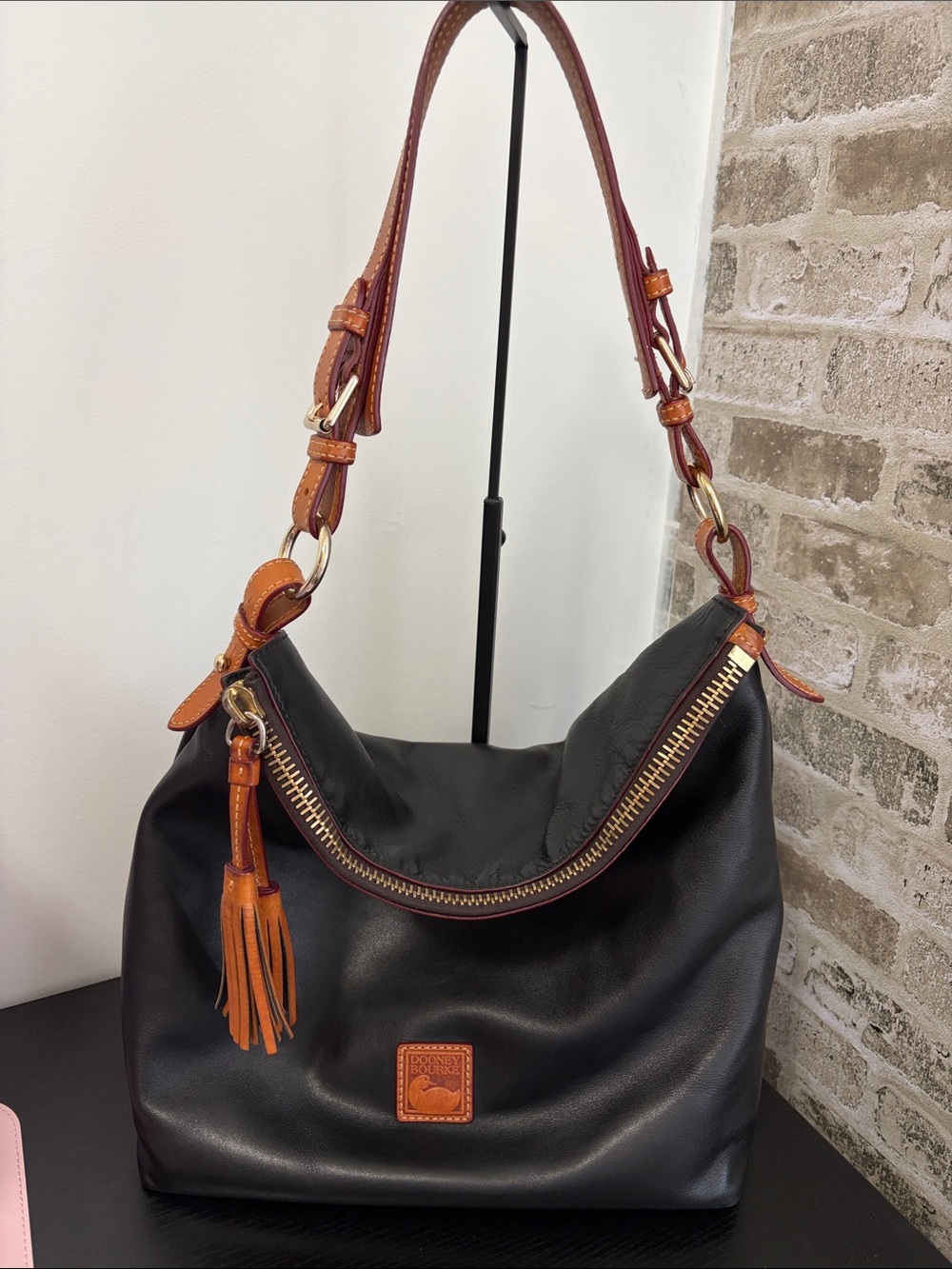 Dooney & Bourke Black Leather Shoulder Bag with Brown Trim